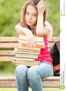 http://www.dreamstime.com/royalty-free-stock-photography-sad-young-student-girl-sitting-bench-books-image20733967
