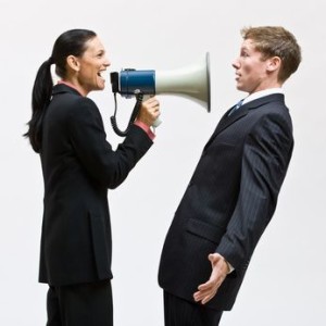 Businesswoman using megaphone
